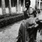 A frightened farmer carries his wife, stricken with tetanus, to the People's Health Centre in Savar, Bangladesh.
