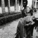 A frightened farmer carries his wife, stricken with tetanus, to the People's Health Centre in Savar, Bangladesh.